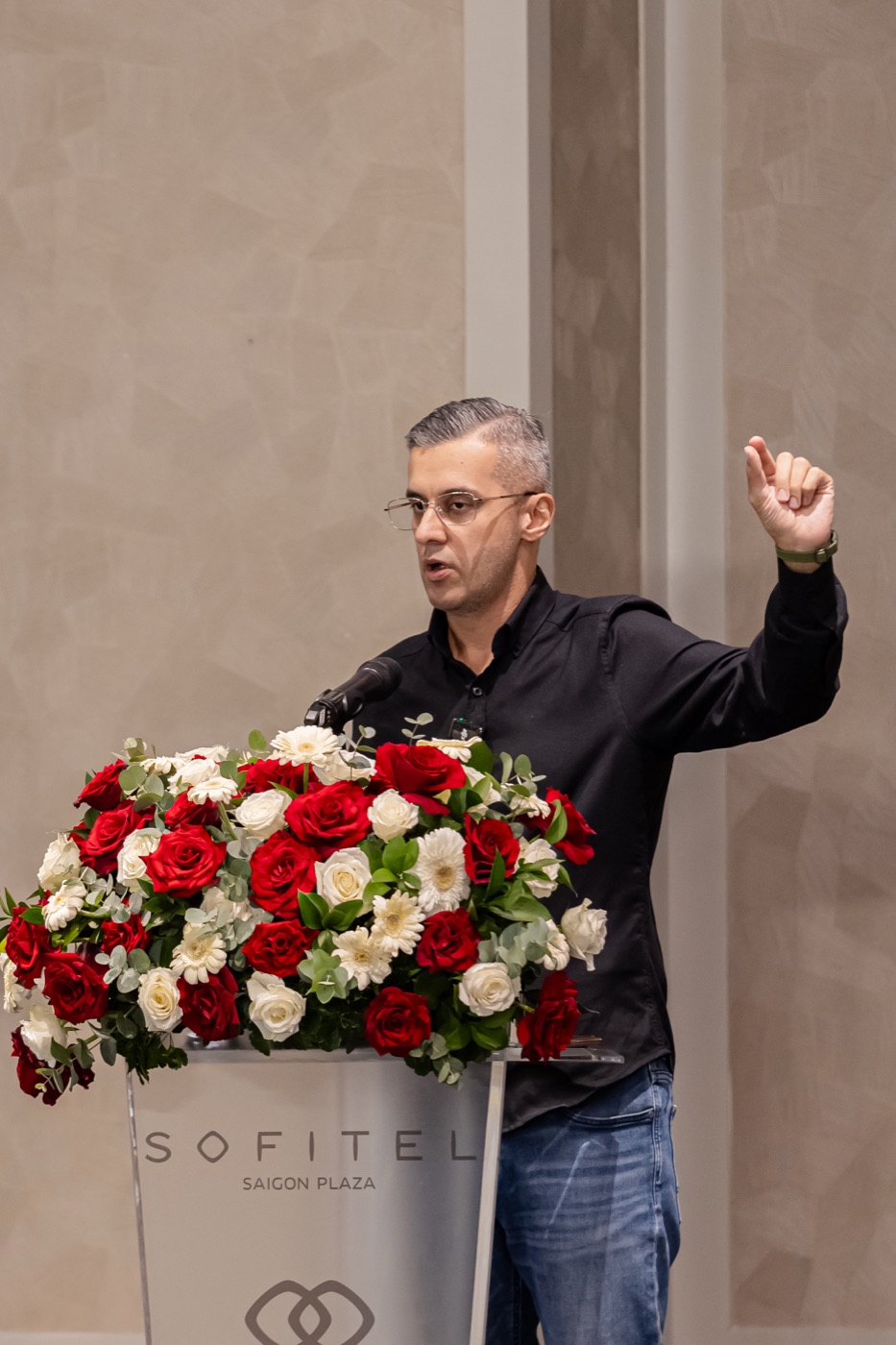 Raj Goodman Anand speaking at a conference